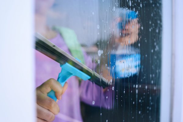 woman-cleaning-window-2023-11-27-05-25-46-utc (1)